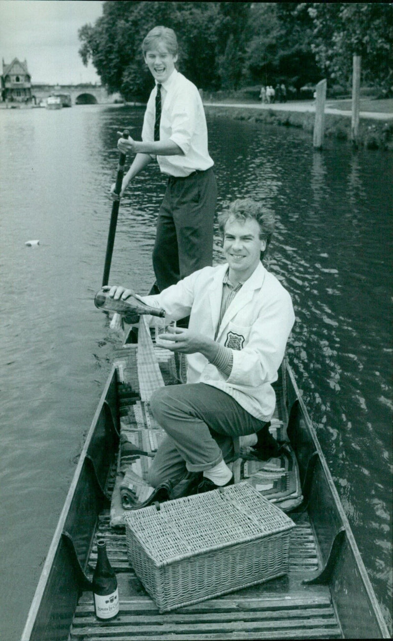 Students Stephen and Dominic offer a picnic and punt service for leisurely excursions on Oxford backwaters. - Vintage Photograph