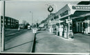 Customers fill up their tanks at a petrol station on October 20th, 2020. - Vintage Photograph