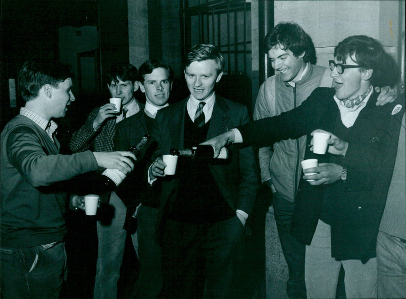 Conservative supporters celebrate Chris Patten's victory outside a town hall. - Vintage Photograph