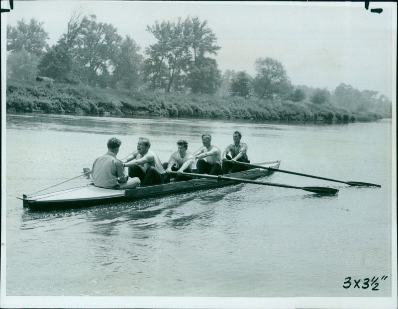 Masters and boatman from St. Edward's School launch a plastic training clinker at Wallingford. - Vintage Photograph