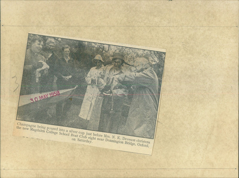 Mrs. N.K. Deveson christens the new Magdalen College School Boat Club eight. - Vintage Photograph