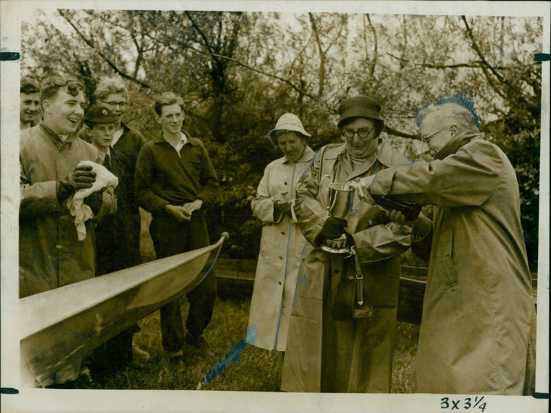 Mrs. N.K. Deveson christens the new Magdalen College School Boat Club eight. - Vintage Photograph