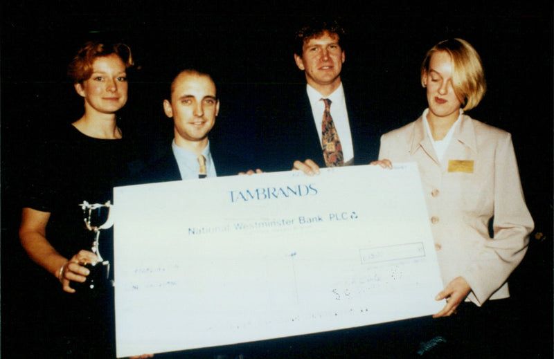 Three students from Headingten School Boarding Club receive a cheque from Westminster Bank PLC. - Vintage Photograph