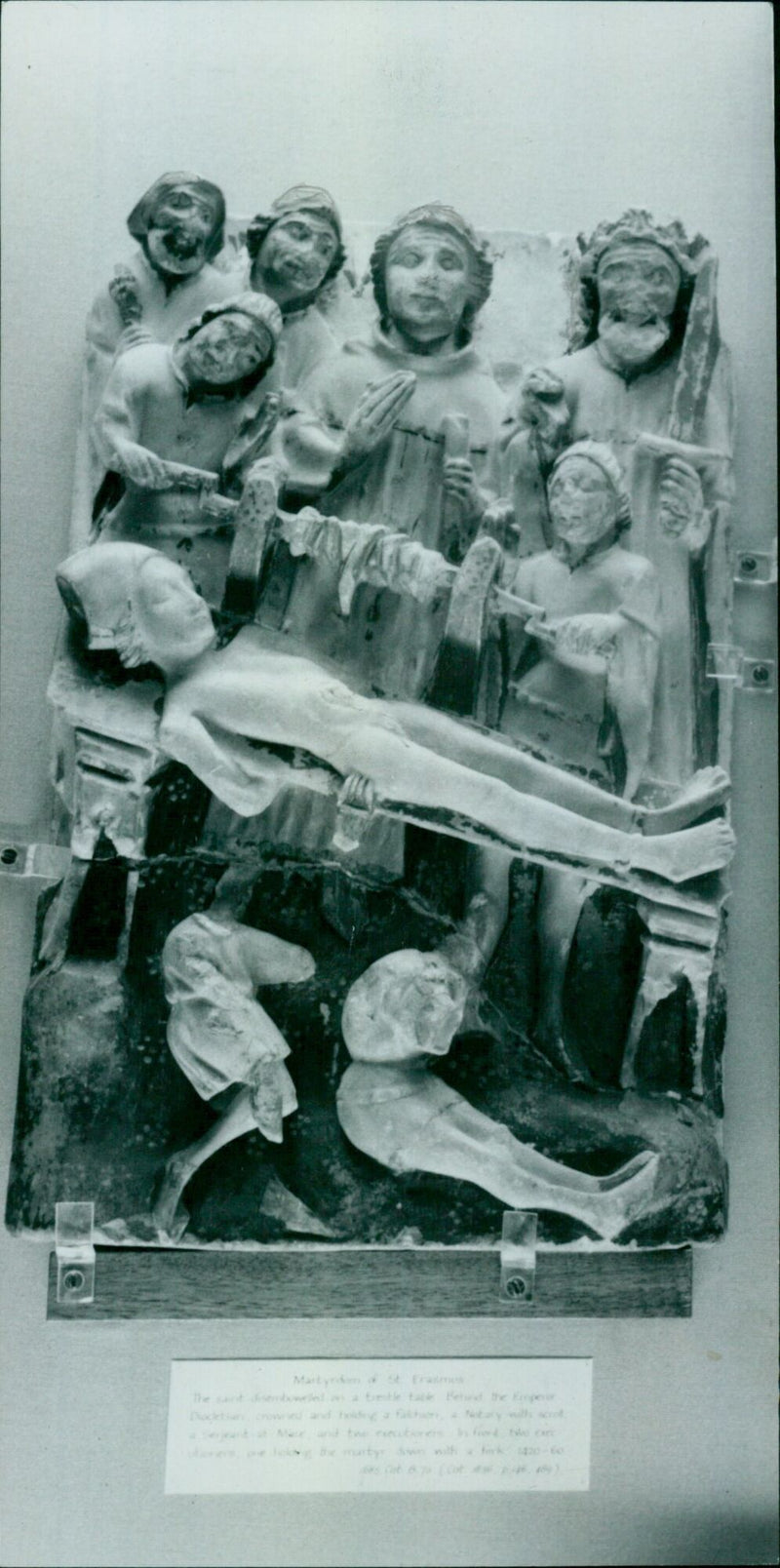 A man is seen performing a ritual on a birtle table. - Vintage Photograph