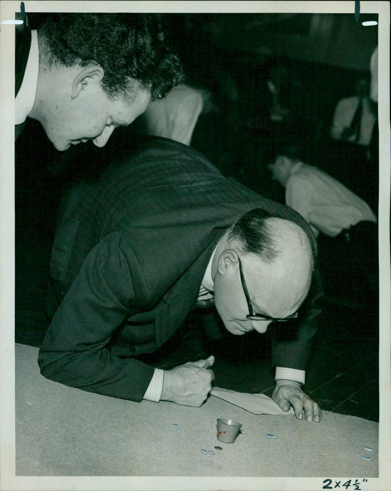 Members of the Ox University Clubs compete in a tiddlywinks tournament. - Vintage Photograph