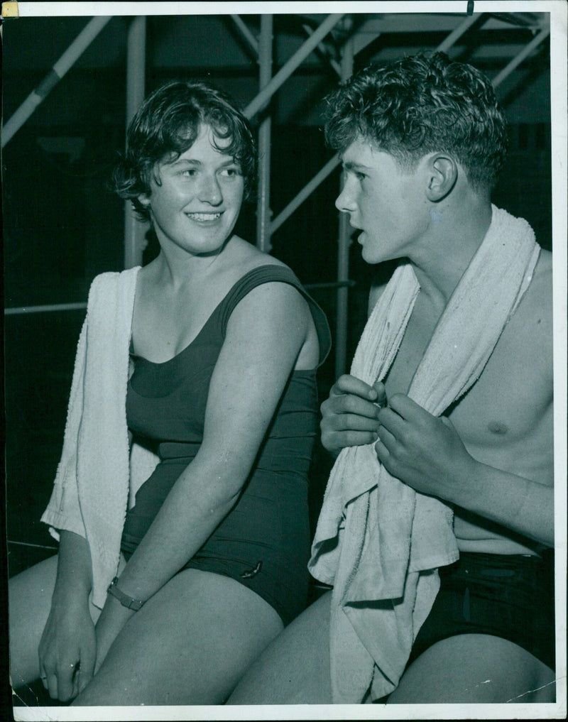 Miss P. Pitt and other successful swimmers congratulate Miss D. Day on winning the 100 yards backstroke. - Vintage Photograph