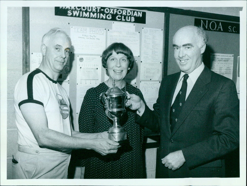 Members of the Marcourt-Oxfordian Swimming Club pose for a team photo at the Ferry Parents Shospace. - Vintage Photograph