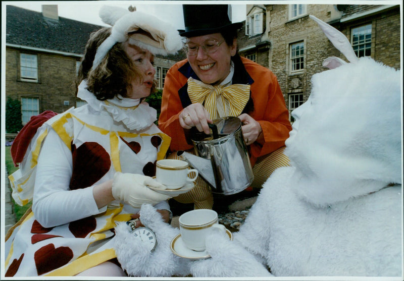 Oxford students dress up for a Mad Hatter's tea party. - Vintage Photograph