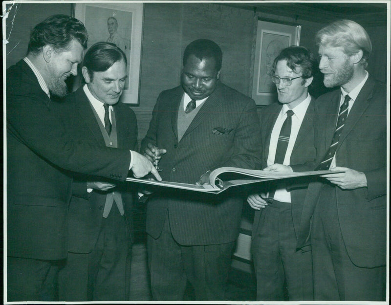 The High Commissioner of Swaziland, Mr S. M. Kunene, receives a new atlas of his country from the Oxford University Department of Agricultural Science. - Vintage Photograph