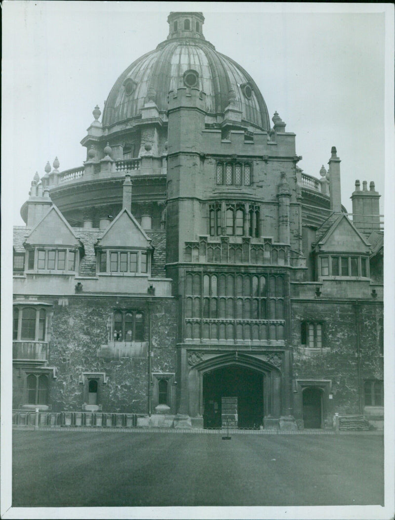 Students from Brasenose College enjoy a meal outside of the Radcliffe Camera on March 24, 2020. - Vintage Photograph