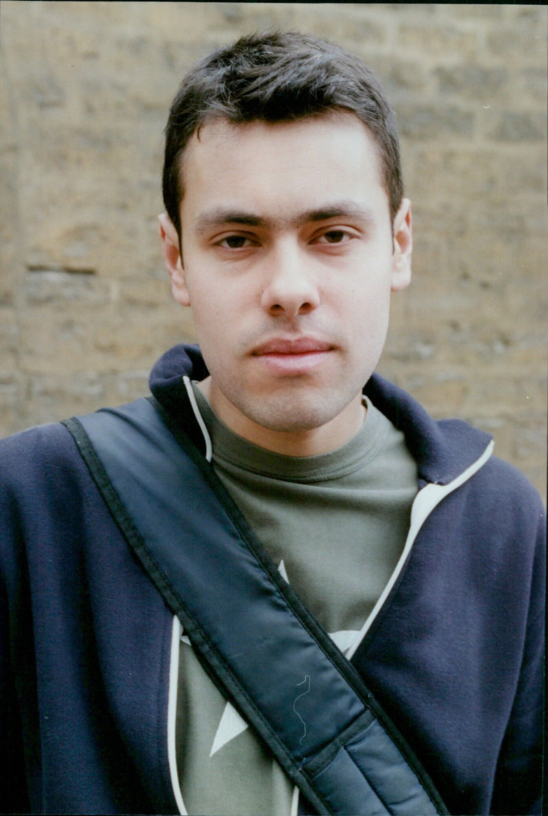 Sasha Ismail, the last student who refused to pay tuition fees, outside Sommerville College. - Vintage Photograph