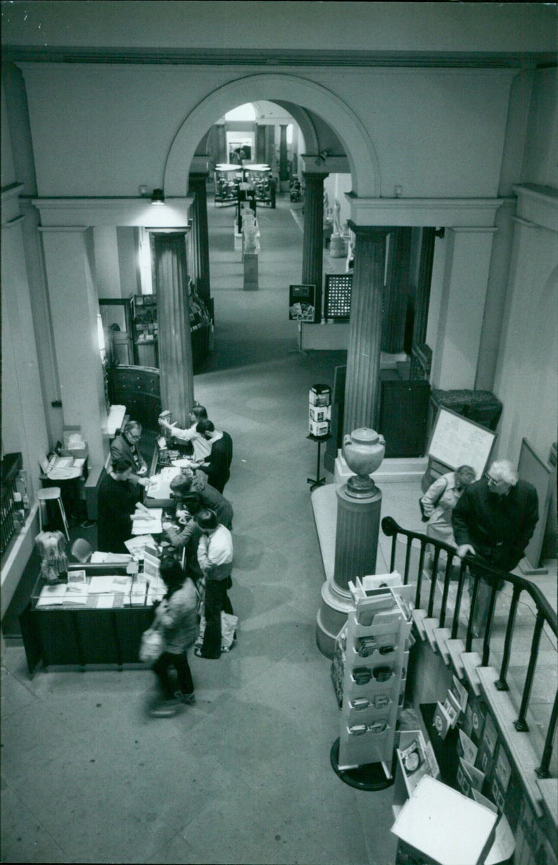 People touring the Ox.onivasM. 193 Museum in Oxford, England. - Vintage Photograph