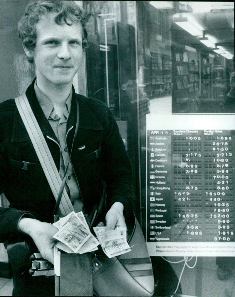 In Oxford, England, tourists like Theobald Derwatt of Munich have limited options when it comes to exchanging foreign currency. - Vintage Photograph