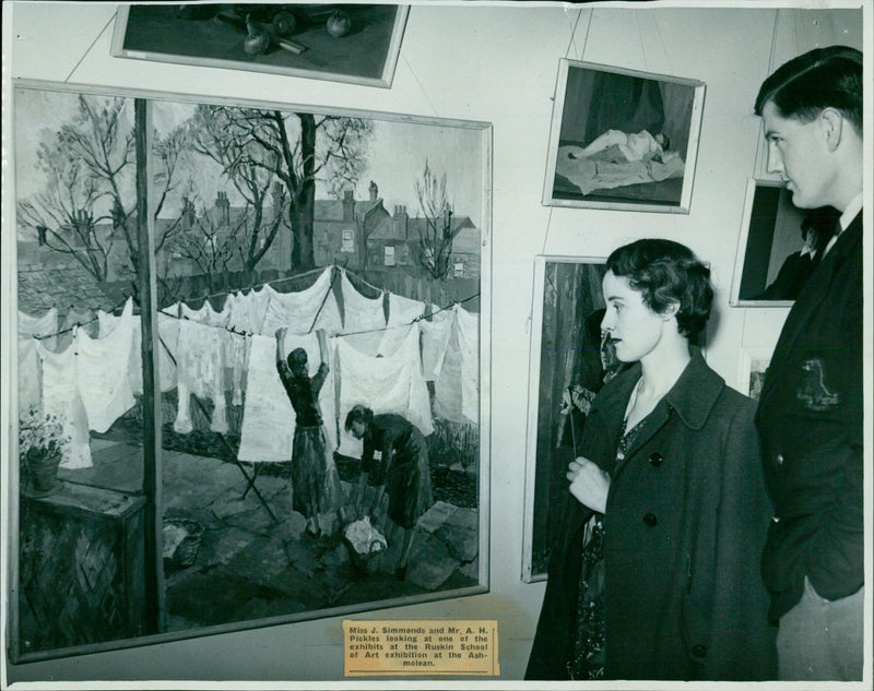 Miss J. Simmonds and Mr. A. H. Pickles view an exhibit at the Ruskin School of Art exhibition in Oxford. - Vintage Photograph