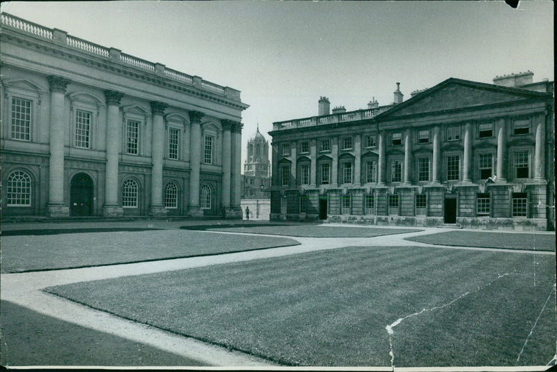 Students and visitors enjoy the picturesque Christ Church Peckwater Quad in Oxford, England. - Vintage Photograph