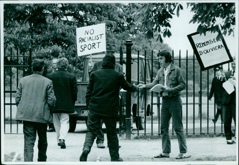 Anti-apartheid protesters handing out leaflets outside an Oxford University cricket match. - Vintage Photograph