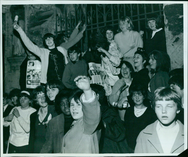 Students roll out a red carpet at Magdalen College in preparation for the Commemoration Ball. - Vintage Photograph