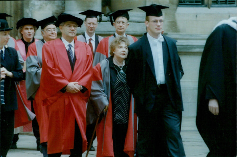 A procession of Oxford University degree recipients from Balliol College to the Sheldonian Theatre. - Vintage Photograph