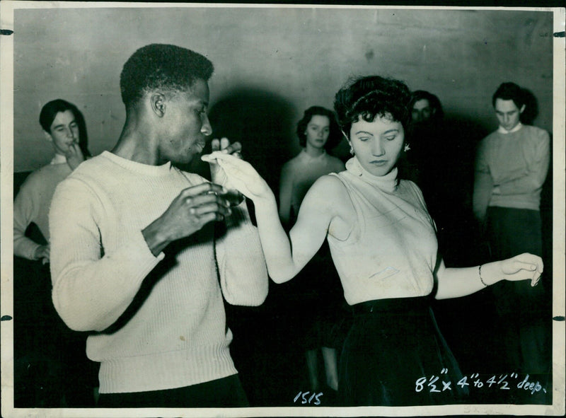 Rex Nettleford leads two of his pupils in a step demonstration. - Vintage Photograph