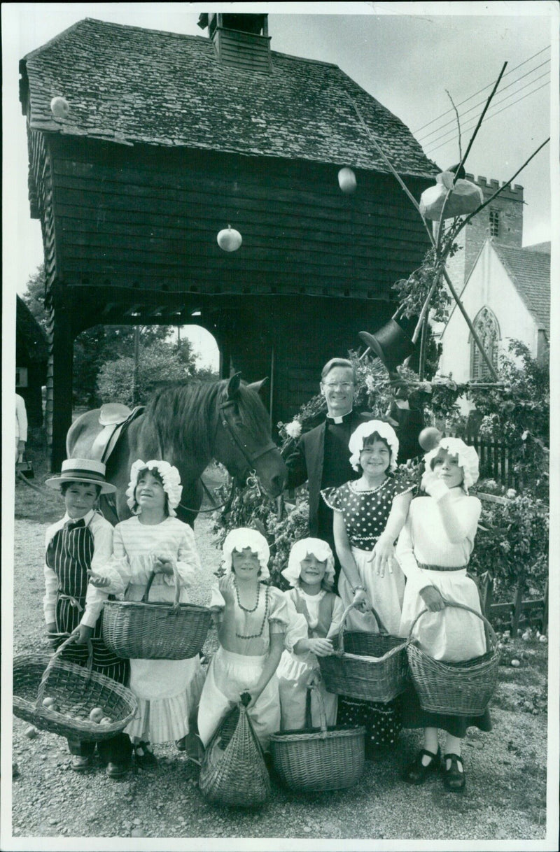 A young boy throwing an apple at a wall with four cook wiches. - Vintage Photograph