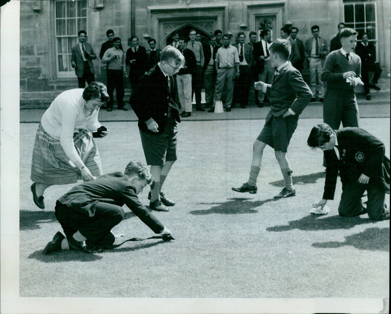 Oxford choirboys and one choirgirl join in the traditional Ascension Day scramble for pennies. - Vintage Photograph