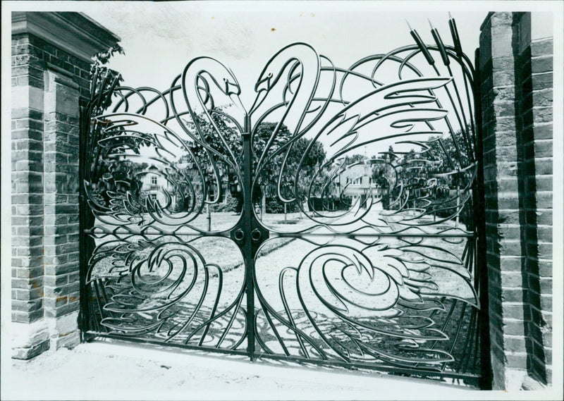 The Swan Gates of St Hugh's College are seen against a newly planted lime avenue and carriage drive. - Vintage Photograph