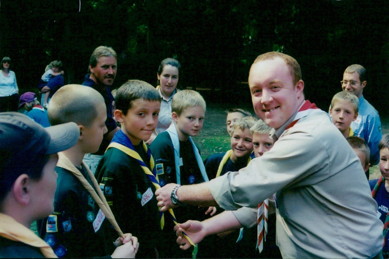 Michael Hurd from Wantage demonstrates to Daniel Davies from Headington how to tie a Friendship Knot. - Vintage Photograph