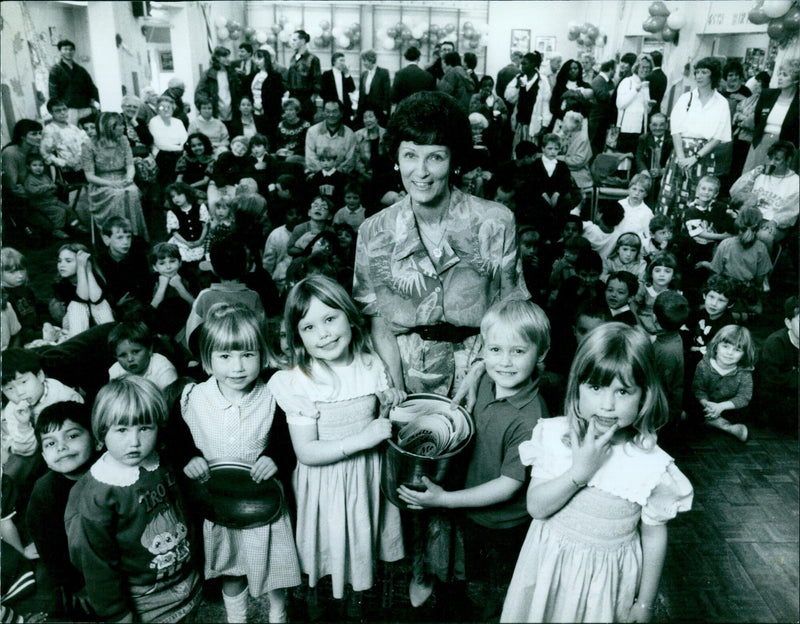 Mrs. Ann Jones and students from St. Michaels First School celebrate the school's 65th birthday. - Vintage Photograph