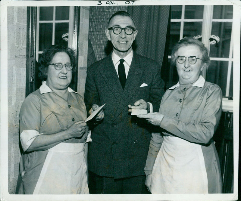 Cafeteria waitresses Gertie Irons and Winnie Buckingham celebrating their long service at the Cadena Café in Oxford. - Vintage Photograph