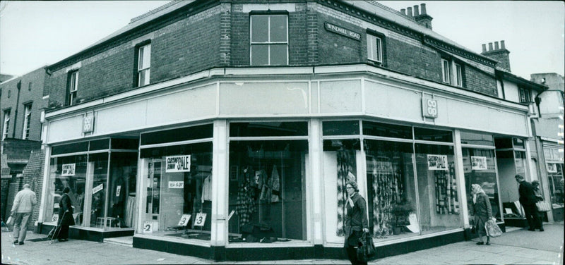 Hundreds of people line up outside a store in Oxford hoping to purchase a limited-edition item. - Vintage Photograph