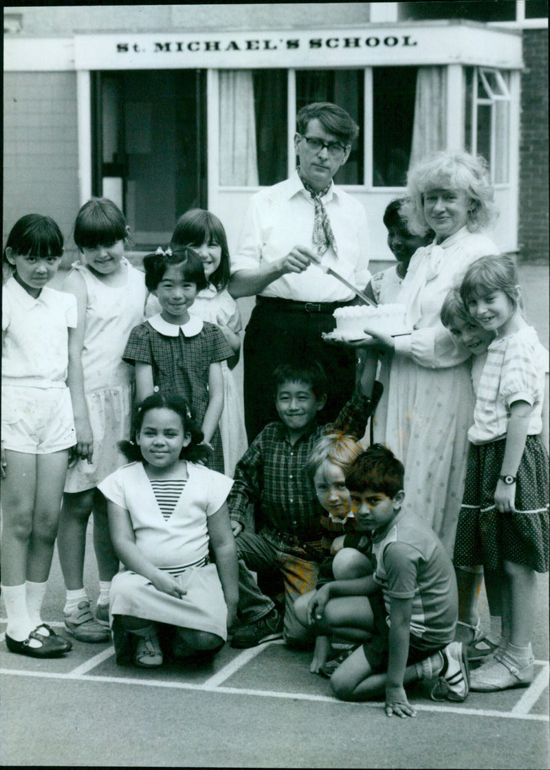 Retiring head Mr. Michael Howard is presented with a farewell cake by pupils and parents of St. Michael's Church of England School in Marston, Oxford. - Vintage Photograph