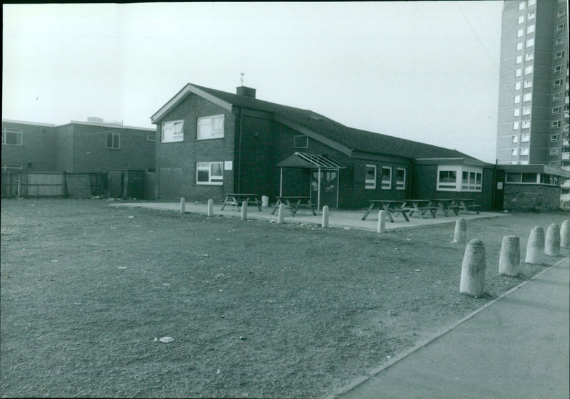 Police officers investigate a crime scene in a pub car park. - Vintage Photograph