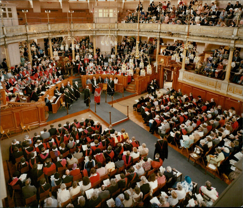 Students celebrate and receive their diplomas at Oxford University degree ceremonies. - Vintage Photograph