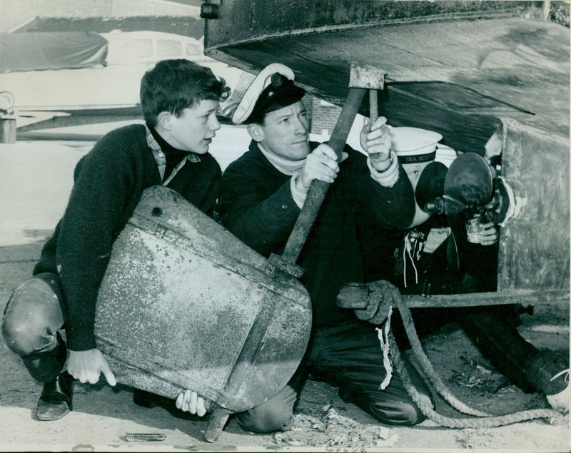 Members of the 42nd S.S. Philip and James Sea Scout Troop working to prepare holiday cruises on Juxon Street Wharf. - Vintage Photograph