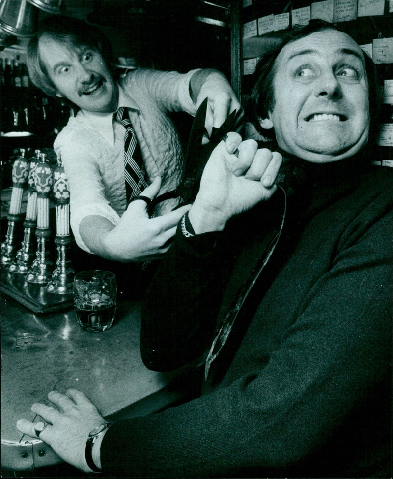 Doctors performing CPR during a medical emergency. - Vintage Photograph