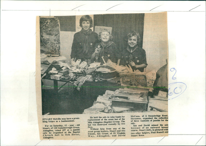 12-year-old Stuart Melville organizes a jumble sale to raise funds for a scout hut. - Vintage Photograph