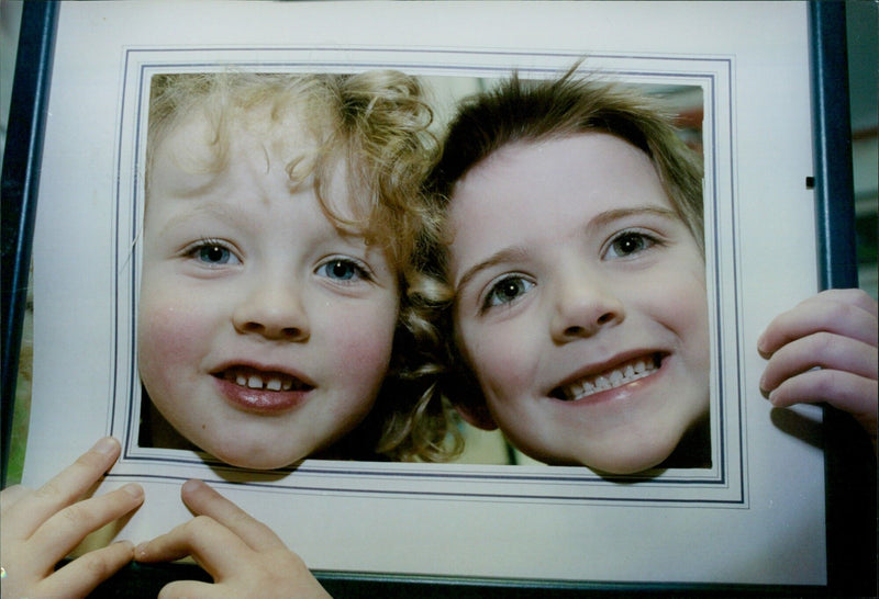 Anna Wotherspoon and Angus McWilliam check out a painting during an exhibition of 205 works by students of Oxford SS Philip and James First School. - Vintage Photograph