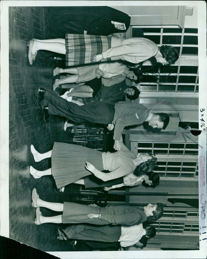 Mr. Peter Lund instructs a group in folk dancing. - Vintage Photograph