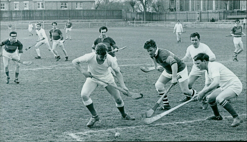 Hertfordshire and Warwickshire face off in a goalmouth scramble during a hurling match. - Vintage Photograph