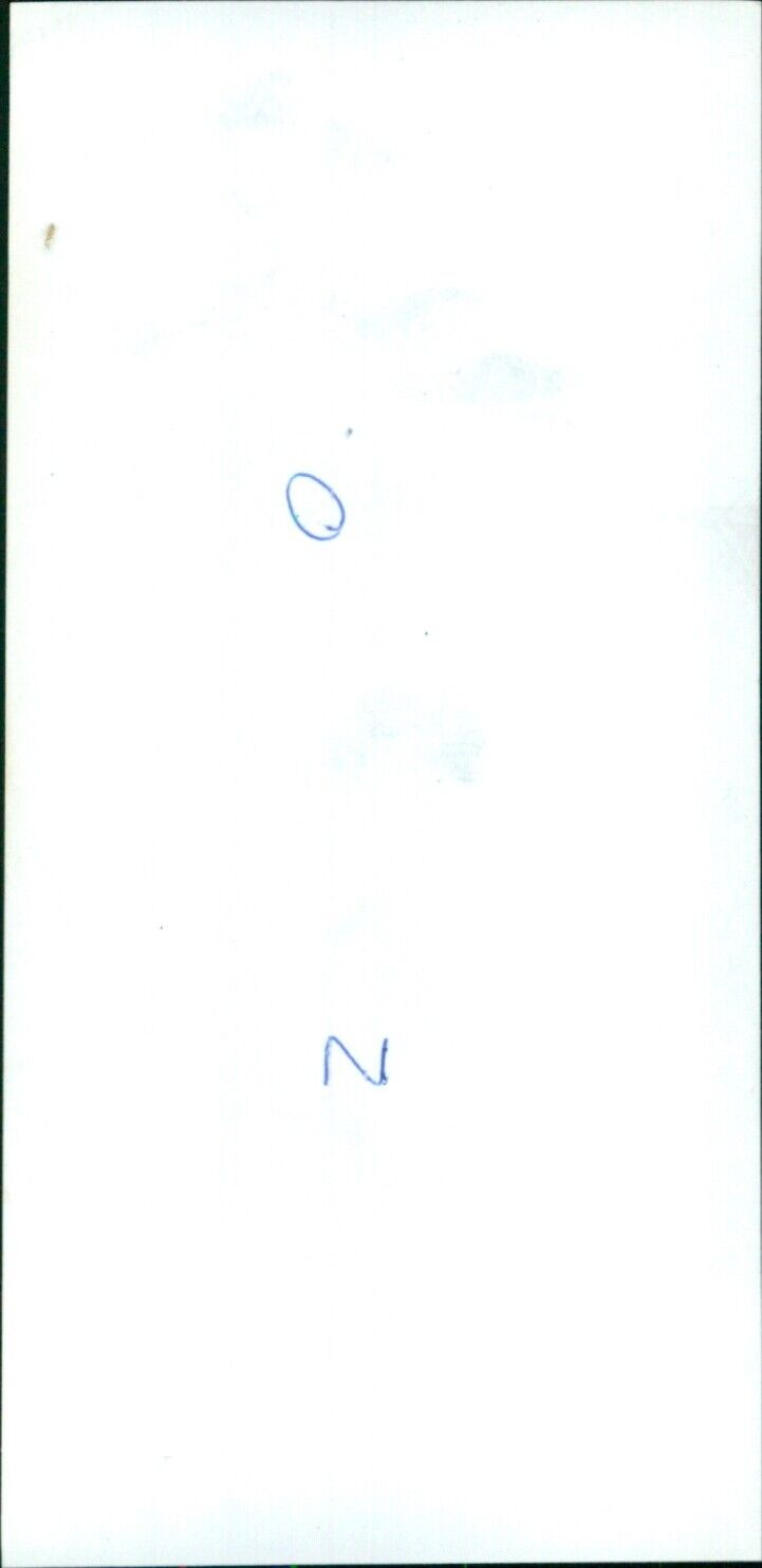 A woman holding a roll of Kodak Safety Film 120. - Vintage Photograph