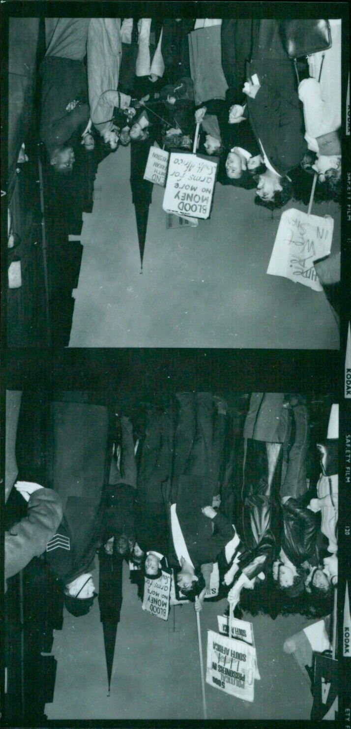 A woman holding a roll of Kodak Safety Film 120. - Vintage Photograph