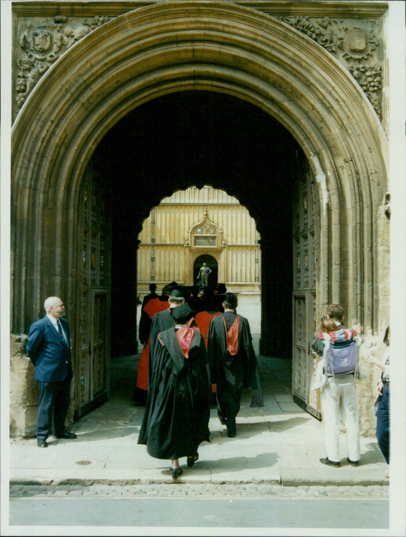 Students, faculty, and other members of the University of Oxford join in the annual Encaenia procession in Oxford, England, on June 19, 1996. - Vintage Photograph