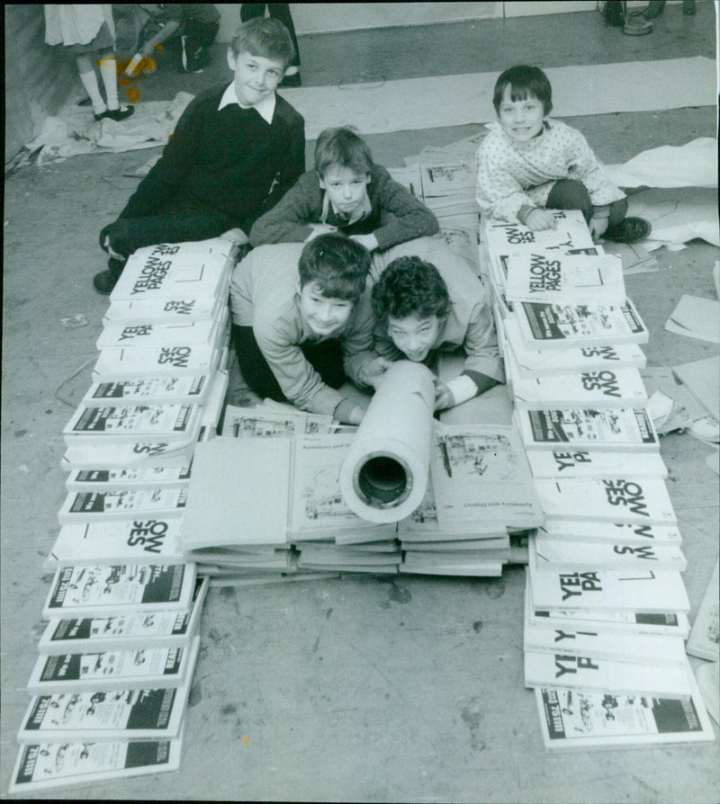 Five boys build a tank from phone directories at the Headington Middle School Museum of Modern Art. - Vintage Photograph