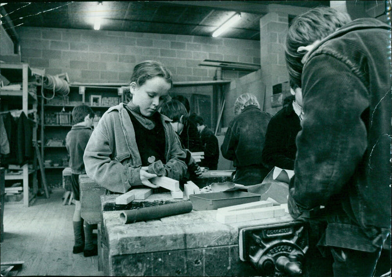 Third-year student Alexandra Lusty works alongside the boys in the woodwork room. - Vintage Photograph