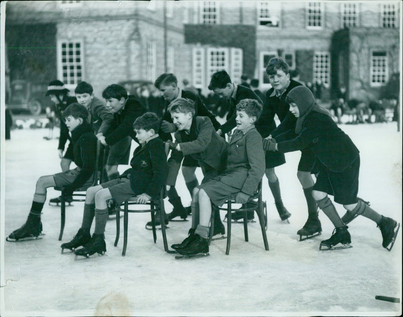 Boys of the Dragon School enjoying the winter weather on the tennis court. - Vintage Photograph