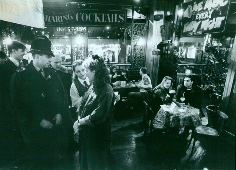 Sergeant Bob Massingham chatting with staff at Old Orleans. - Vintage Photograph