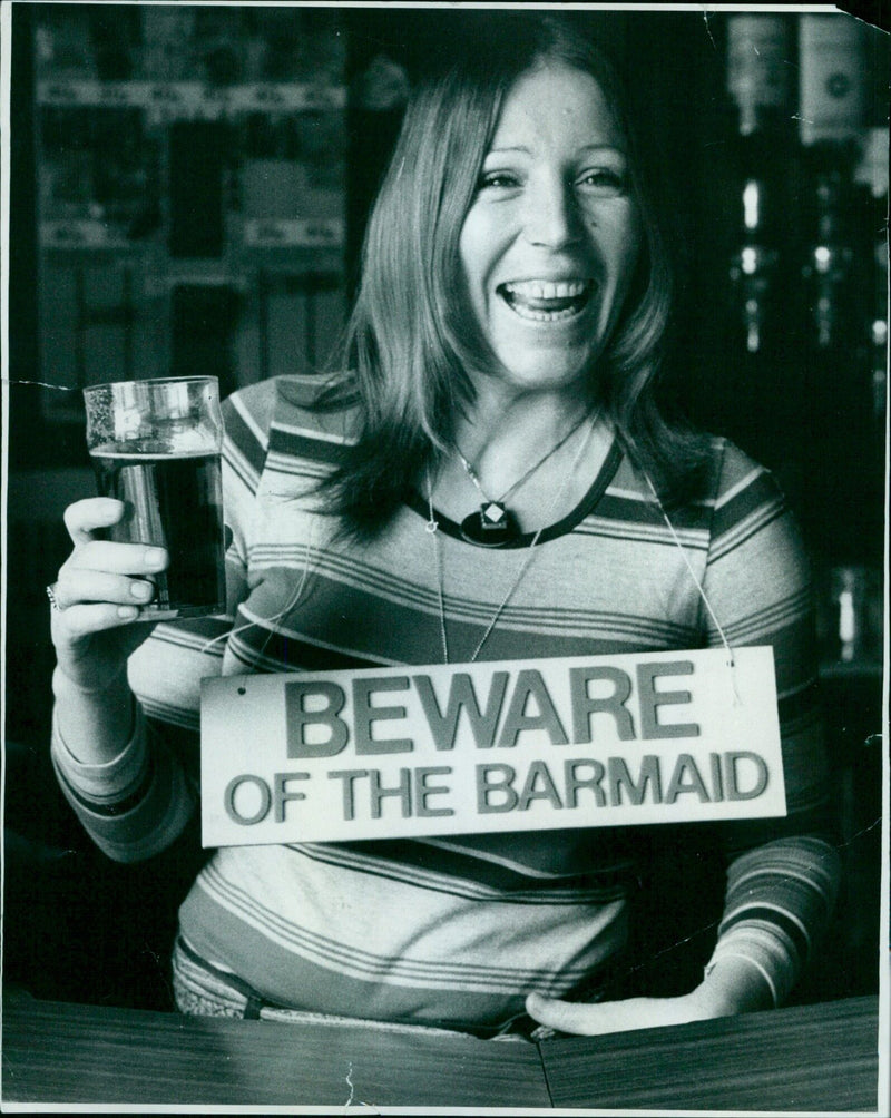 Barmaid Rona Wolbech-Byard serving customers at the Oranges and Lemons pub. - Vintage Photograph