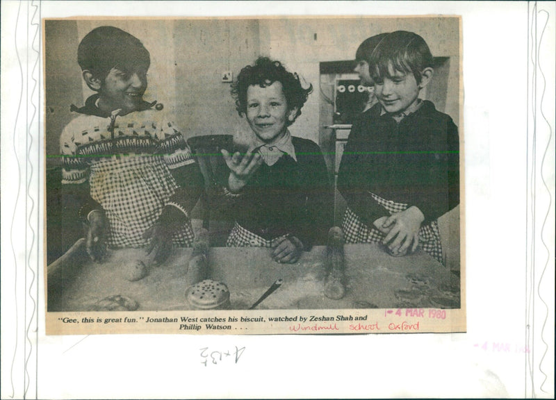 Three schoolmates enjoy a game of catch in Oxford. - Vintage Photograph