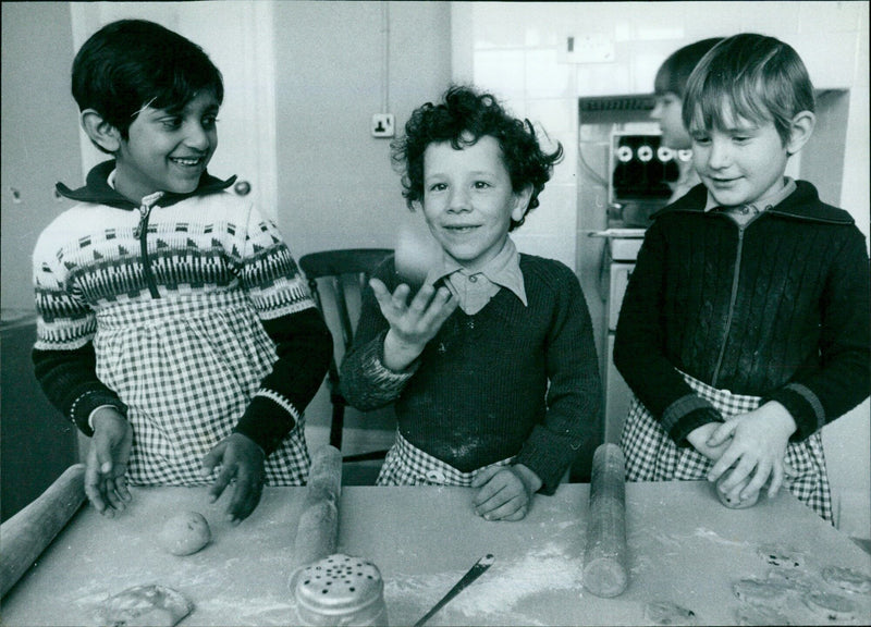 Three schoolmates enjoy a game of catch in Oxford. - Vintage Photograph