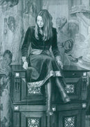 A model wears a 1977 Design 61 fluted velvet suit with liberty peacock print details. - Vintage Photograph